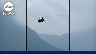 Rescue underway for children dangling from cable car in Pakistan | ABCNL